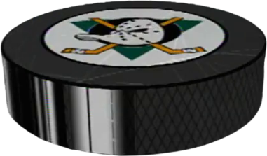 a hockey puck with the Mighty Ducks logo