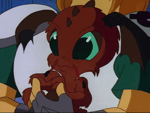 a small red, furry alien with floppy ears, big blue puppy eyes, and a green gem in its belly